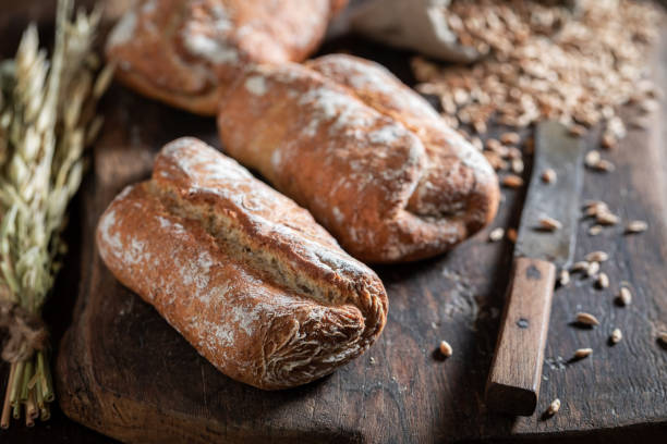 istock Delicious rolls on wooden and old table 1209419537