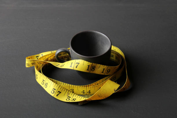 consumo di caffeina - tape measure ruler work tool inch foto e immagini stock