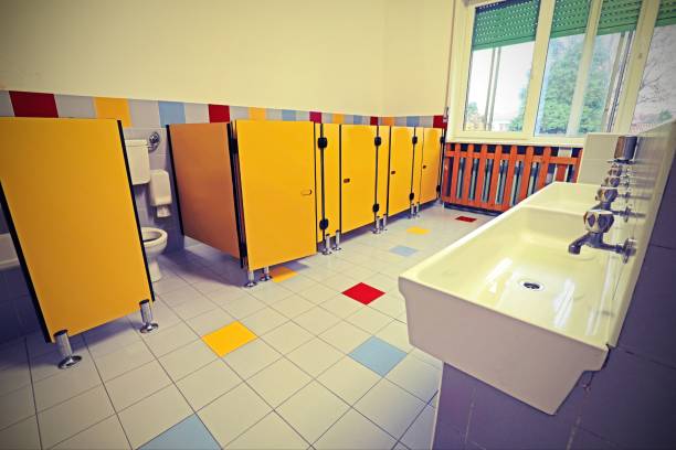 istock washbasin and yellow doors on the bathroom of a kindergarten wit 1209422145