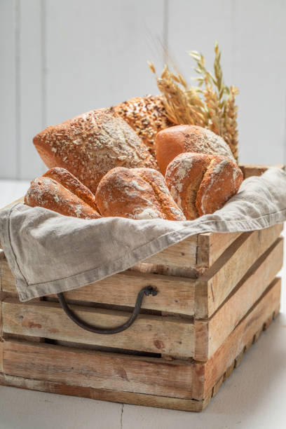 istock Homemade rolls for breakfast in wooden box 1209422297