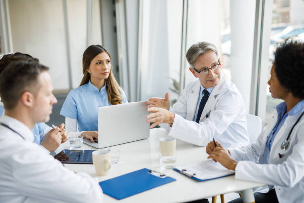 istock Medical team discussing in meeting 1209422401