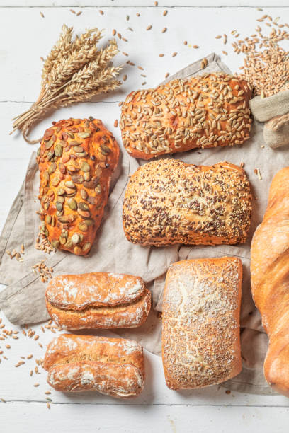 istock Rustic baguettes and buns freshly baked in bakery 1209422456