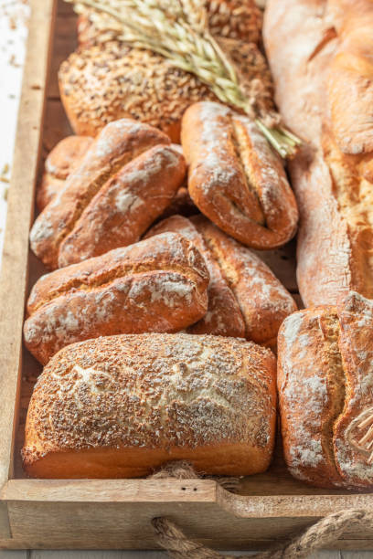 istock Brown baguettes and buns freshly baked in bakery 1209422480