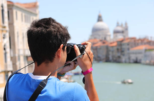 istock Young photographer in Venice in Italy 1209423799