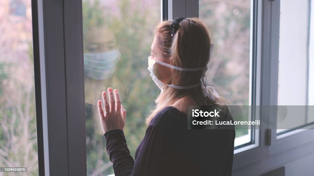horizontal background woman in isolation at home for virus outbreak or hypochondria horizontal background woman in isolation at home for virus outbreak or hypochondria . Coronavirus Stock Photo