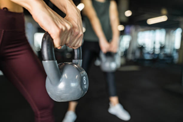 istock Close up of exercising with kettle bell in a gym. 1209424864