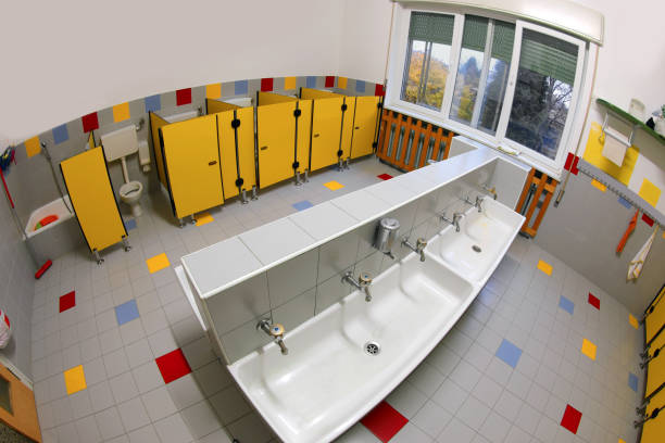 istock school bathroom with yellow doors without children 1209425951