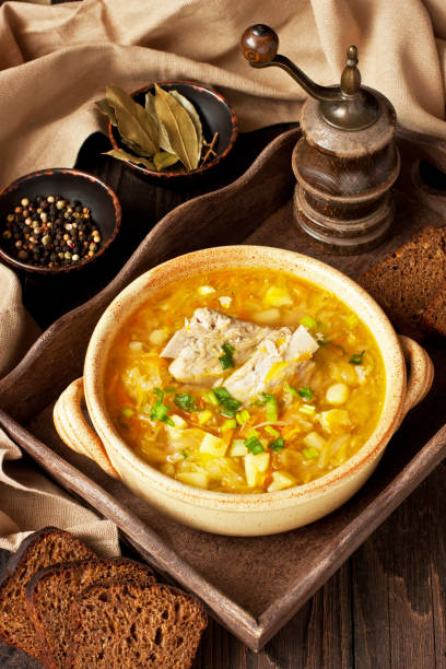 istock Sauerkraut soup in ceramic bowl on wooden table 1209428608