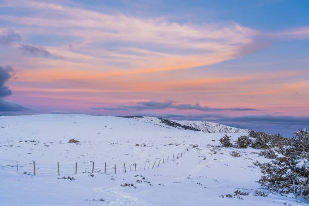 istock Snowy landscape at sunset 1209429404