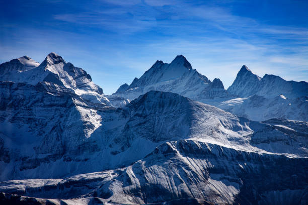 three famous swiss mountain peaks, eiger, mönch and jungfrau - jungfraujoch imagens e fotografias de stock