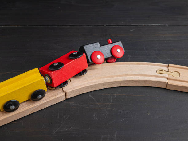 istock Wooden toy train with dark background 1209434028