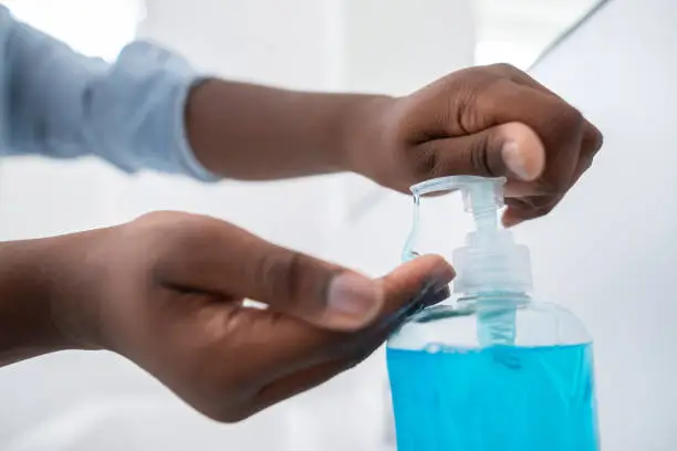 Photo of Close Up Of Boy Washing Hands With Soap At Home To Prevent Infection