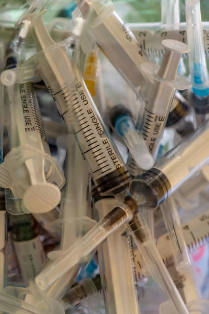 istock Used syringes with needles vaccination 1209439517