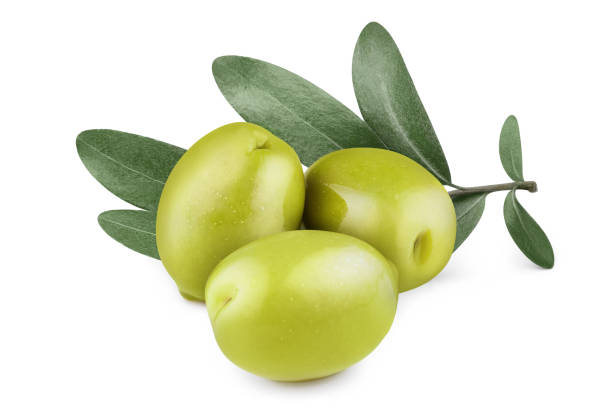 Olives on white Three delicious green olives with leaves, isolated on white background olive tree cut out stock pictures, royalty-free photos & images