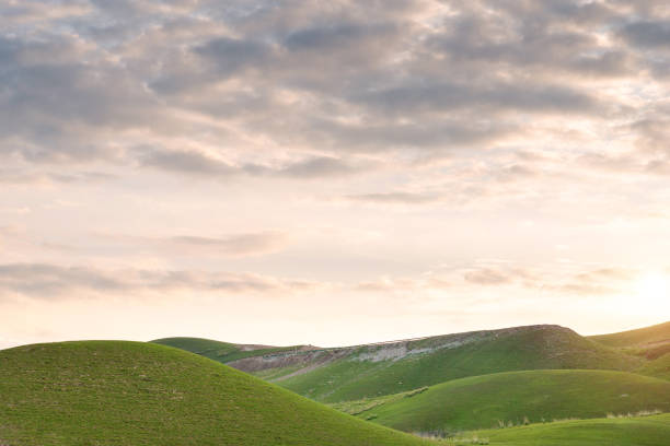 istock Cloudscape and alpine meadows in hills with sunrise 1209444788