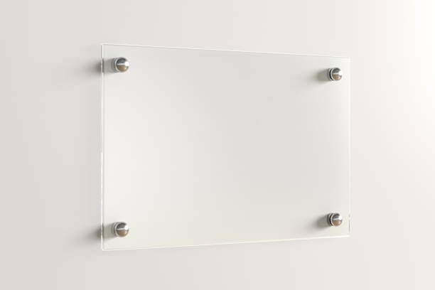 istock Blank transparent glass sign plate on the wall. 1209446100