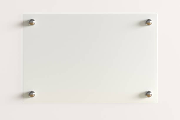 istock Blank transparent glass sign plate on the wall. 1209446115