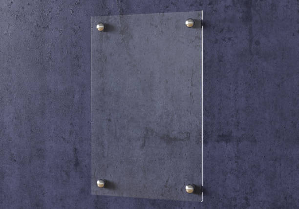 istock Blank transparent glass sign plate on the wall. 1209446133