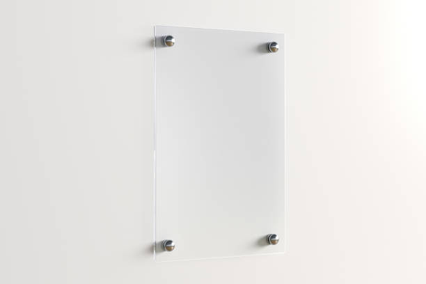 istock Blank transparent glass sign plate on the wall. 1209446145
