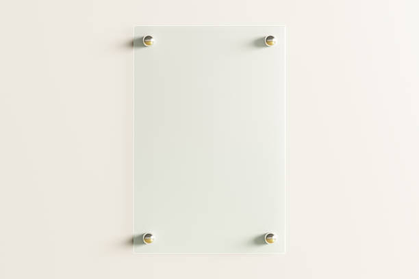 istock Blank transparent glass sign plate on the wall. 1209446150