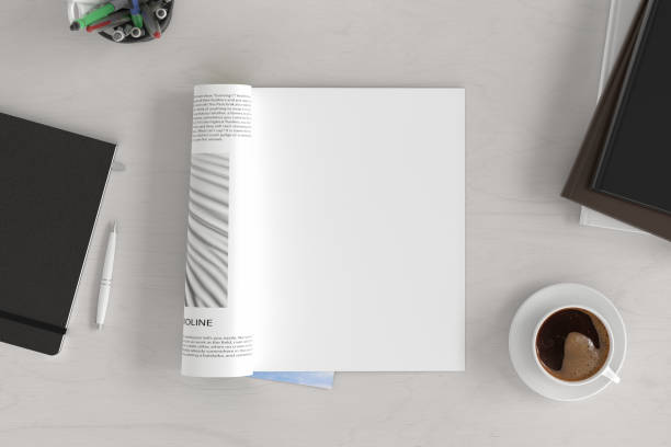 Blank magazine page. Workspace with magazine mock up Blank magazine page. Workspace with magazine mock up on the white desk with cup of coffee. Directly above view. 3d illustration coffee table stock pictures, royalty-free photos & images