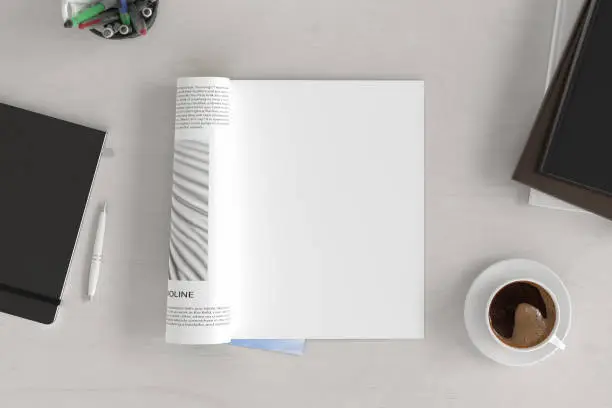 Blank magazine page. Workspace with magazine mock up on the white desk with cup of coffee. Directly above view. 3d illustration