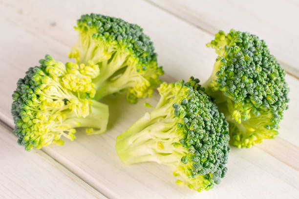 istock Fresh green broccoli on grey wood 1209448305