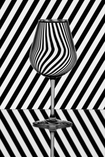 istock Pattern distortions seen through a glass of water. Still life 1209448621