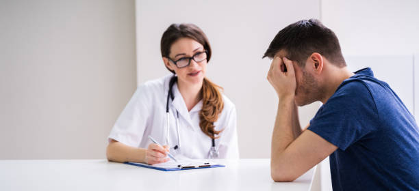 istock Doctor Comforting Patient At Table 1209448761