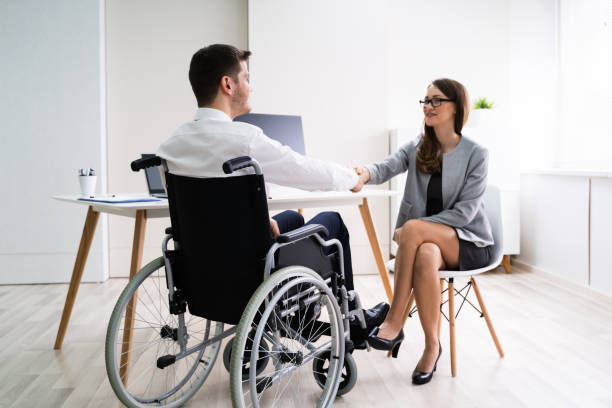 istock Disabled Businessman Shaking Hand With His Partner 1209449875