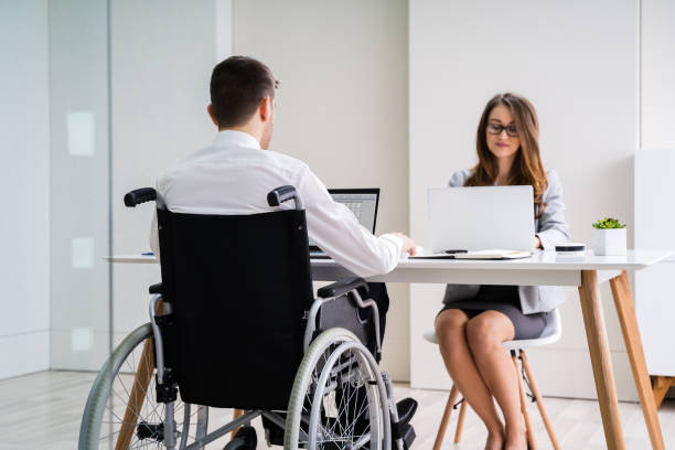 istock Disabled Businesswoman Sitting With Her Partner In Office 1209449882