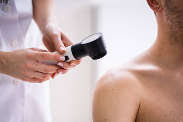 istock Doctor Examining Pigmented Skin 1209449953