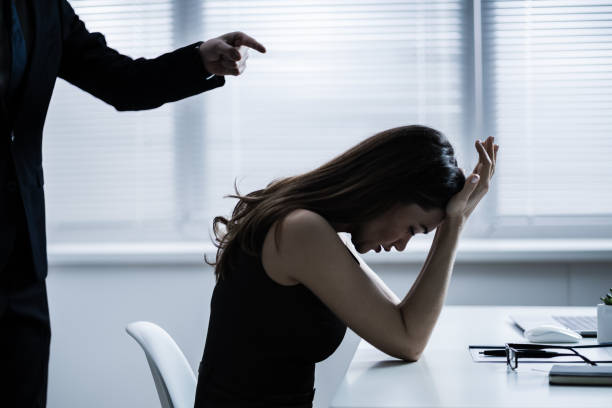 Boss Blaming Female Executive Close-up Of Businessperson Quarreling To Young Businesswoman At Desk harassment stock pictures, royalty-free photos & images