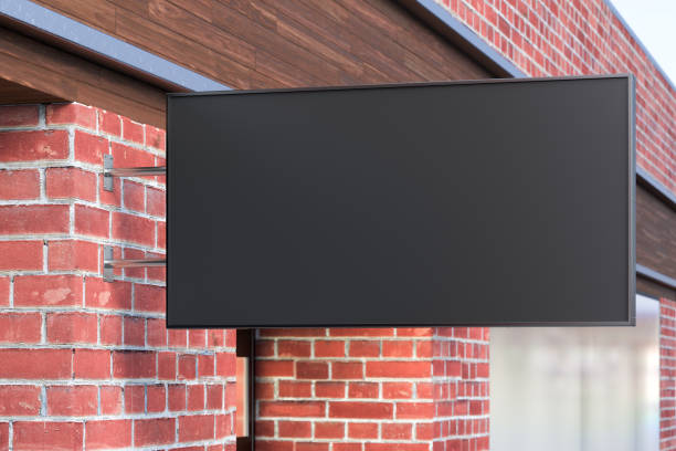 istock Horizontal signboard or signage on the red brick wall with blank black sign mock up. Side view. 1209450279