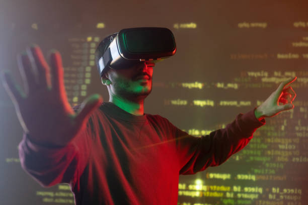 istock Young it-manager with vr headset standing in front of large virtual display 1209452207
