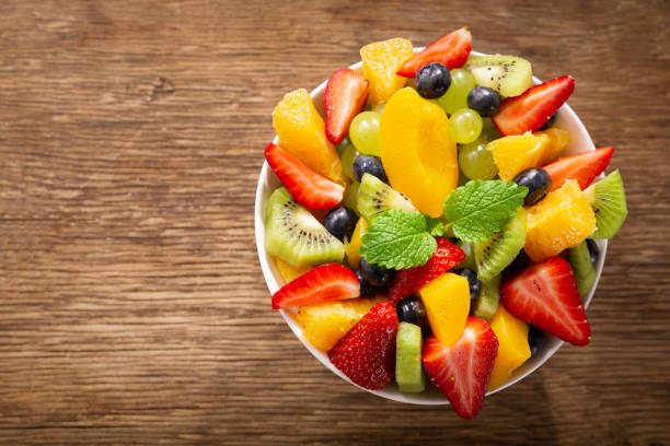 istock bowl of fruit salad, top view 1209456357