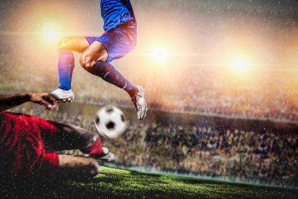 istock Soccer players performs an action play in stadium 1209456909