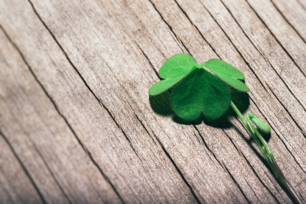 istock Shamrock leaf on shabby wooden background. St. Patrick's Day, selective focus 1209458783