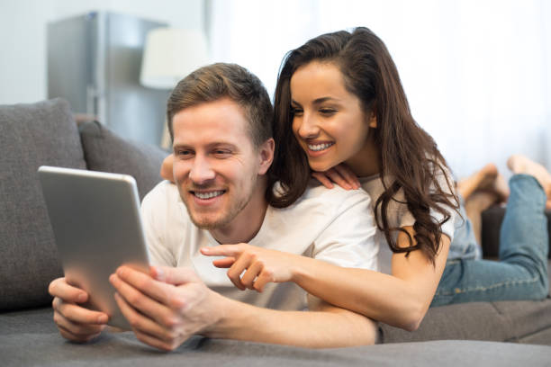 istock Happy young couple spending their time at home 1209459699