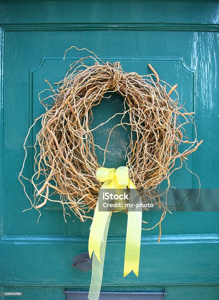 Joyful wreath on turquoise door  Color Image Stock Photo