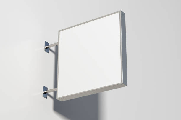 istock Square signboard or signage on the white wall with blank white sign mock up. Bottom view. 1209460766
