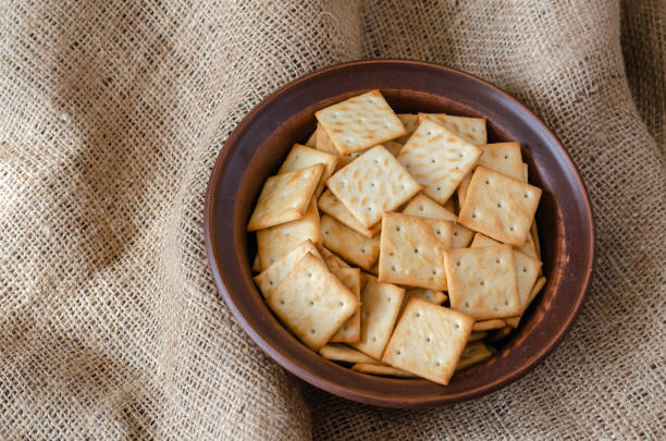 istock Salty Crackers in a clay bowl. 1209460907