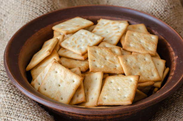 istock A clay bowl full of salty crackers. 1209461010