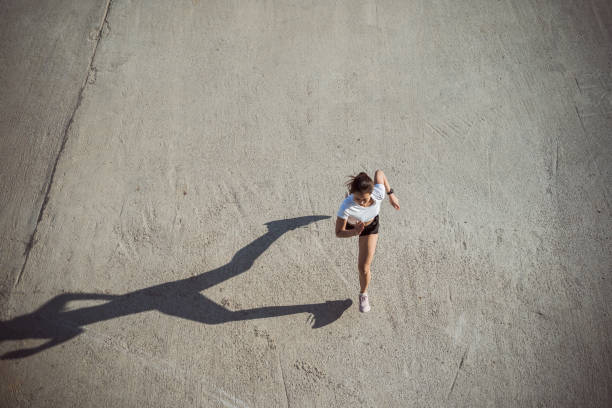istock Woman runners morning exercise, top view image 1209463157