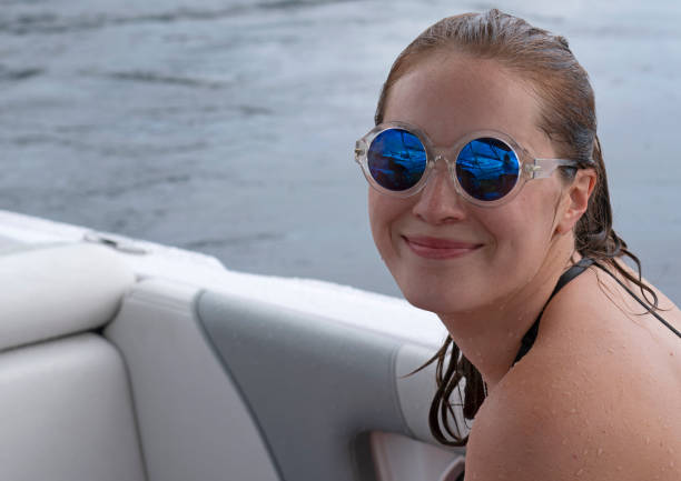 istock Happy young woman on a boat 1209466723
