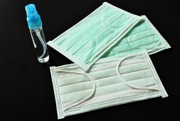 istock hygienic mask and alcohol based hand sanitized spray 1209468429