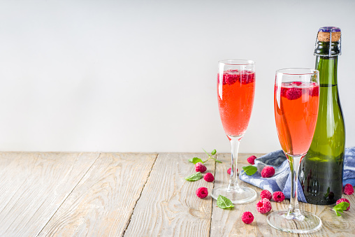 Summer refreshing Alcoholic Drink, Kir Royale Cocktail with Champagne Raspberries