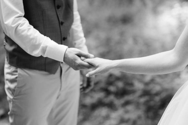 istock the bride and groom held hands 1209469630