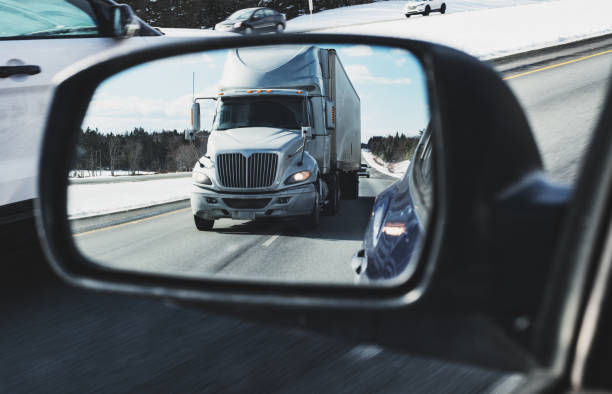 istock Semi Truck in Side Mirror 1209469778