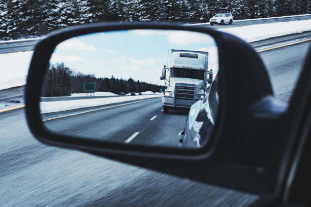 istock Semi Truck in Side Mirror 1209469795